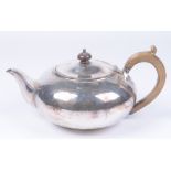 A Victorian silver presentation teapot Of squat circular form plain oval form,
