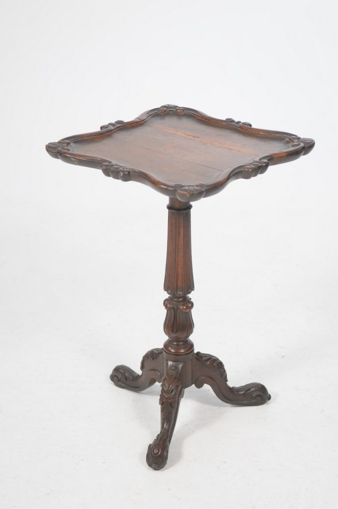 A 19th Century Gillows style oak pedestal table, the square shaped top with a scroll moulded border,