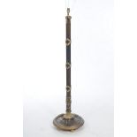 An Early 20th Century Standard Lamp The spreading circular base with reeded exterior,