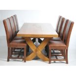 A Contemporary golden oak refectory table and a set of eight conforming high back dining chairs The