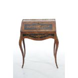 An early 20th Century Louis XV style Kingswood ladies writing desk The rectangular top with a gilt