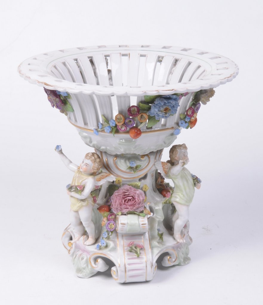 A Dresden Porcelain Centre piece The central stem on scroll supports,