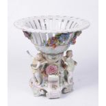 A Dresden Porcelain Centre piece The central stem on scroll supports,