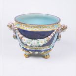 A Victorian Joseph Holdcroft Majolica Jardiniere Of typical Ovoid form rising from four swept bird