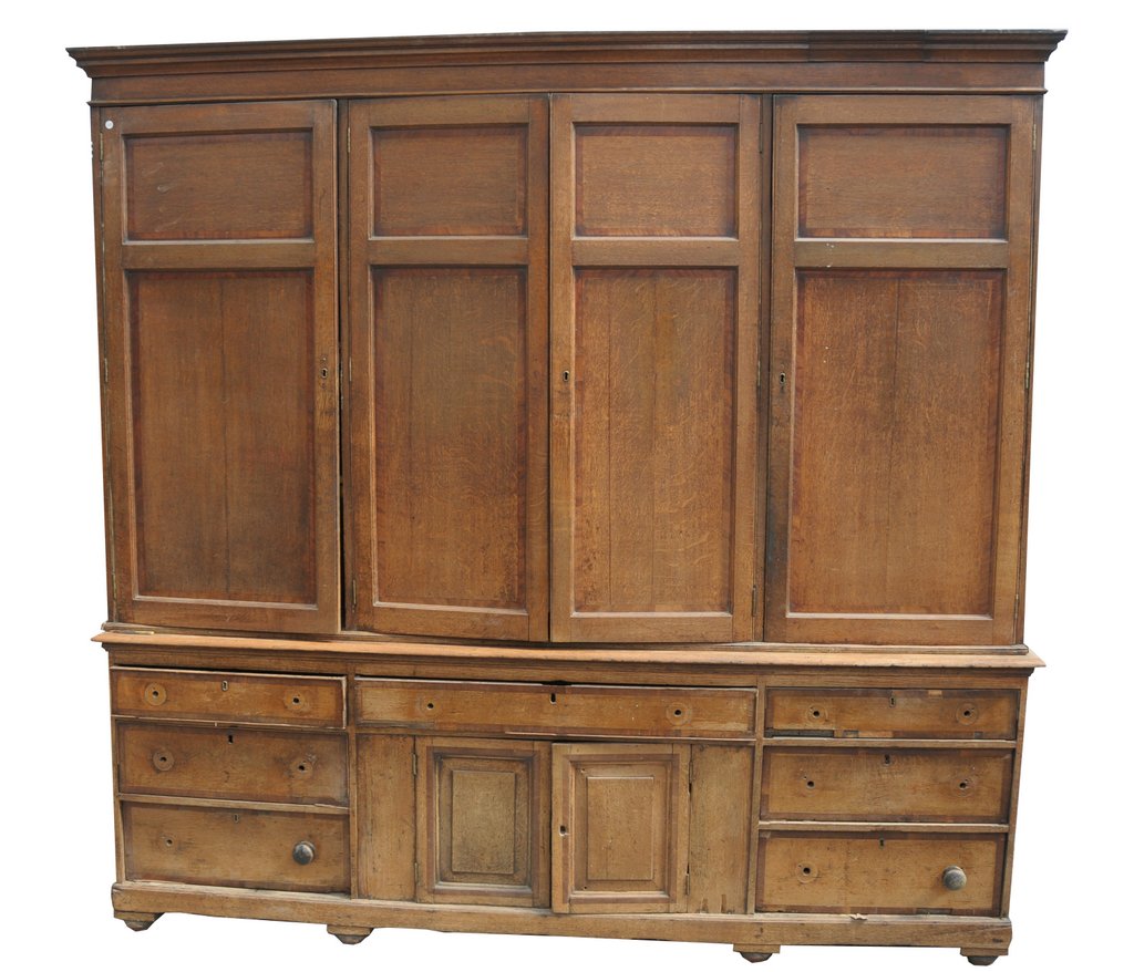 A George III oak and mahogany crossbanded housekeepers cupboard,