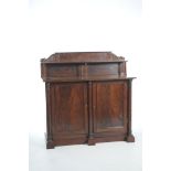 A Regency mahogany sideboard The raised back with a shelf supported by three ring turned tapering