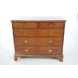 A Georgian honey oak chest of drawers The rectangular three plank moulded top above two short and