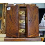 A Victorian walnut table top nest of three short drawers, each with brass flush handle,