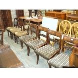 A Set of four 19th Century mahogany dining chairs with a leaf carved crest rail ,