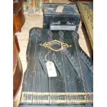 An Ebonised and gilt embellished zither and a Dublin band melodium.