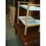 A Modern pine coffee table and a serving trolley.