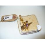 Three 9ct gold bar brooches to include an amethyst bug brooch,