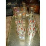 Four 1950's gilt decorated glass beakers and four other similar beakers.