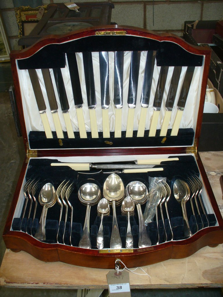 A Mahogany canteen of plated cutlery.