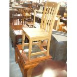 A Modern hardwood glass top coffee table and a modern light oak dining chair.