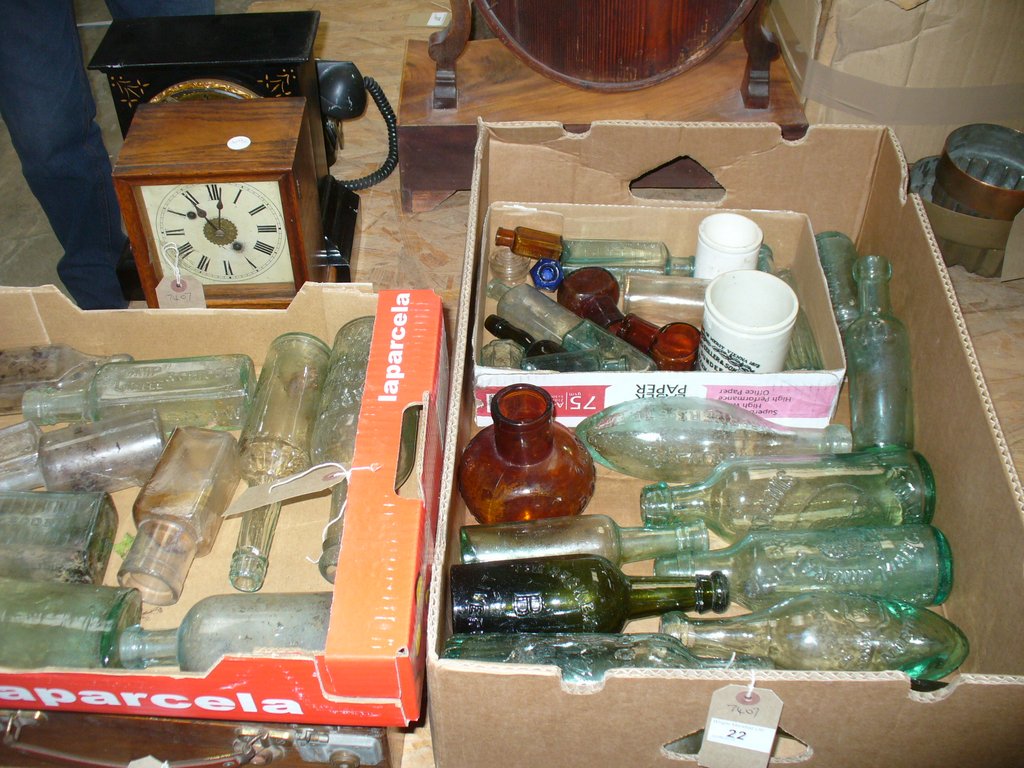 A Large collection of old glass bottles including " Fulfords , Grosvenor, Manchester" ,