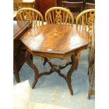 A Victorian inlaid rosewood octagonal centre table on curvilinear legs.
