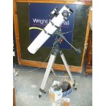 A Meade digital electronic auto locator telescope and tripod.