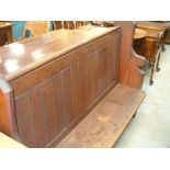 A Pitch pine church pew with a panelled back ( approx. 5' ).