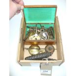 A Collection of clock keys, clock pendulums and wall clock weights.