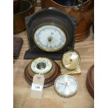 Four assorted barometers including an oak cased wall barometer.