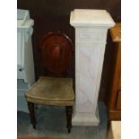 A marble effect composition pedestal and a Victorian mahogany shield back hall chair (2).