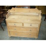 A Victorian pine tray top wash stand with two short and two long drawers with glass knob handles.