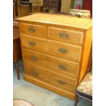 A Late Victorian ash chest of drawers with two short and three long drawers brass drop handles and