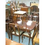 A 20th Century mahogany draw leaf extending table on cabriole legs and pad feet and a set of four