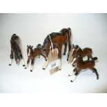 Five assorted Royal Doulton and Beswick bay pony and foal figures.