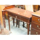 A 19th Century mahogany folding tea table The rectangular hinged top above a single frieze drawer