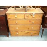 A Victorian pine chest of two short and three long drawers, turned wooden handles.