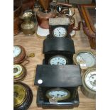 A Victorian slate mantel clock with a white enamelled dial and two train movement,