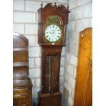 A Victorian mahogany cased eight-day longcase clock The arched upper pediment surmounted by three