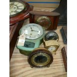 A Smiths Enfield metal cased wall clock, three assorted alarm clocks and a mantel clock.