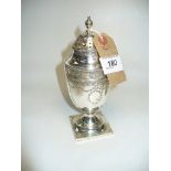 A Silver sugar caster of baluster form with a pierced domed cover and chase decorated with harebell