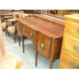 A Regency mahogany sideboard with a single drawer flanked by two convex cupboard doors each with