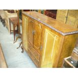 A mid 20th Century walnut side by side display cabinet with a pair of cupboard doors flanked by