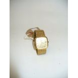 Rotary: A gold tone calendar bracelet strap wristwatch, With a shaped square face,