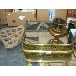 A 19th Century pierced brass fender, carpet beaters, cutlery tray, brass oil lamp,