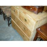 A pine chest of two short and two long drawers.