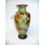 A Doulton Lambeth " Autumn leaf " pattern vase of tapering form .