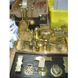 A collection of brass ornaments and horse brasses including horses and traps, fire companion,