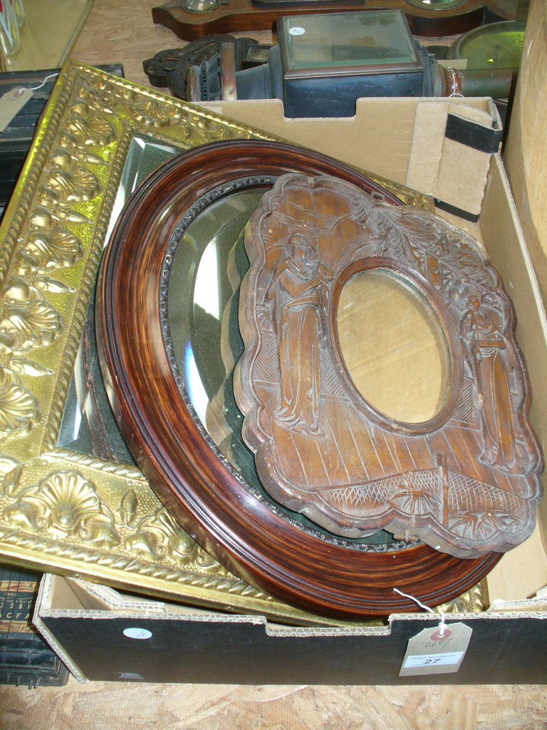 A Carved Japanese hardwood oval wall mirror,