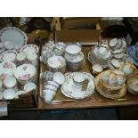 Three trays of tea wares including Crown Staffordshire rose pattern, Royal Standard,
