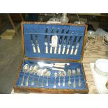 An Oak canteen of silver plated cutlery.