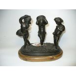 A late 19th Century Spelter figure group after Claude Michel Clodion The three cast putti holding