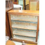 A Victorian mahogany open bookcase with three shelves.