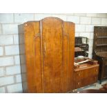 A 1930's two piece bedroom suite comprising single wardrobe and dressing table.