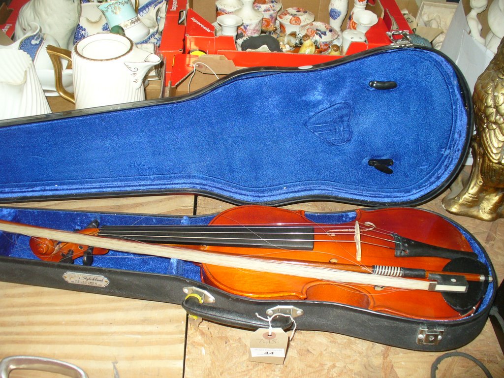 A Cased students violin.